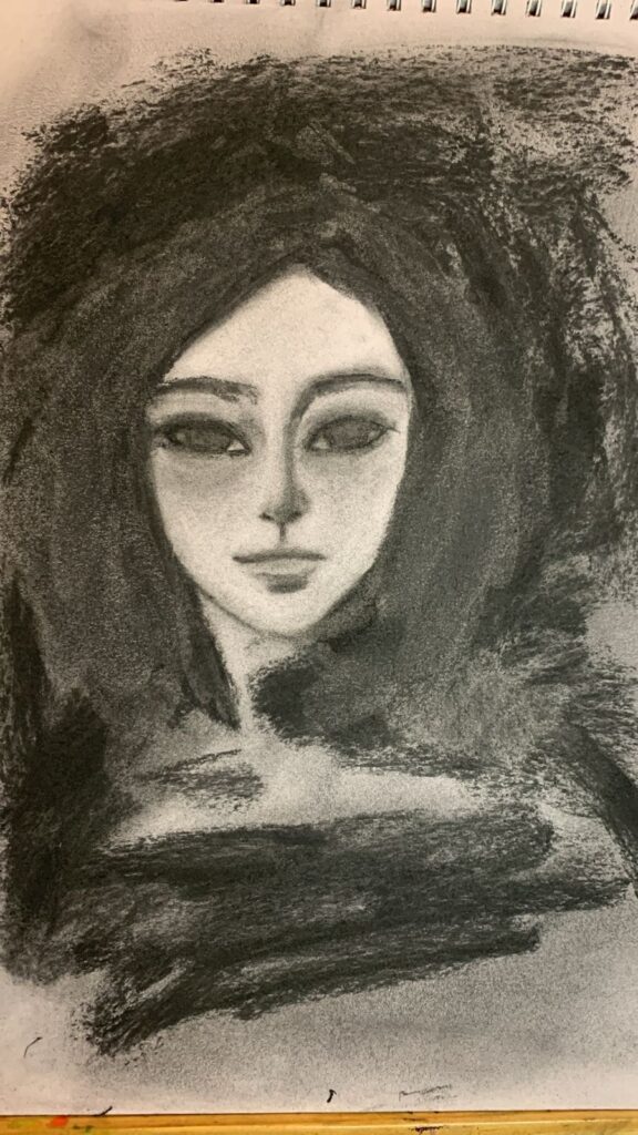 A close up of Ode to Odia commissioned charcoal drawing.